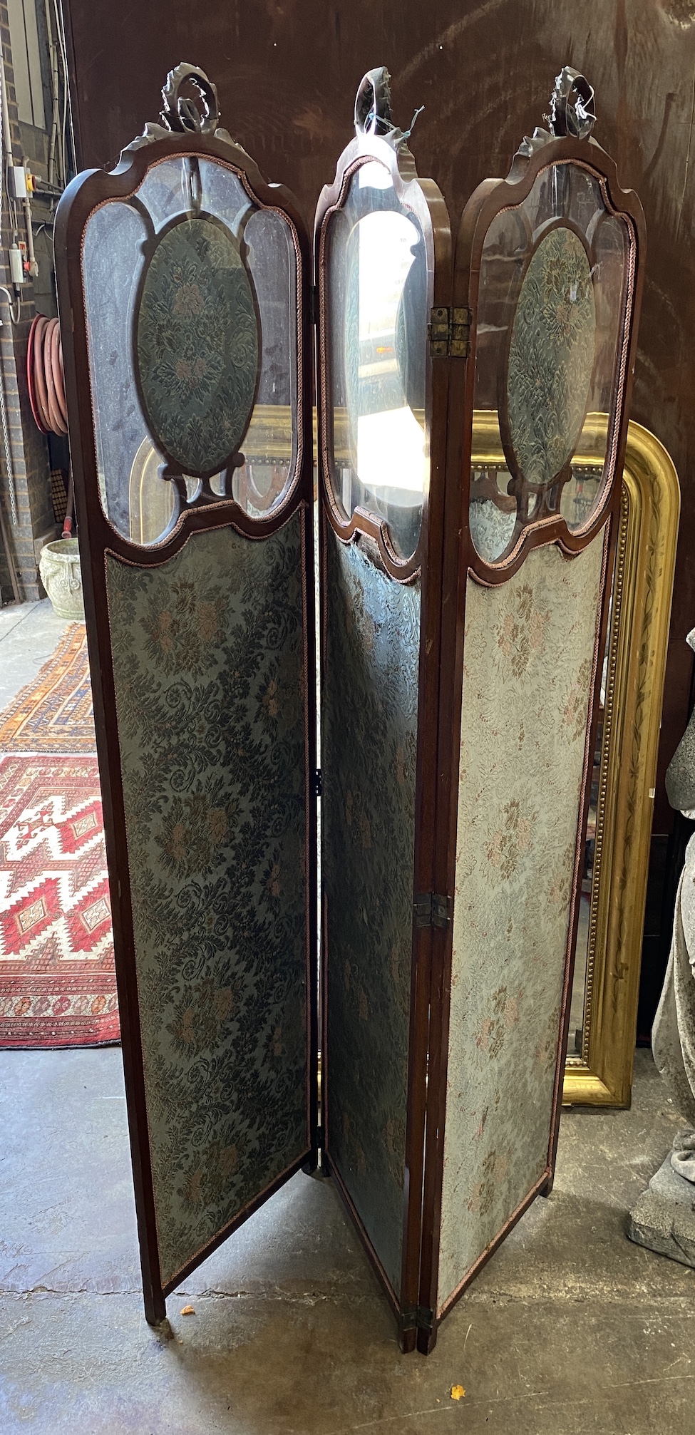 An Edwardian inlaid glazed mahogany three fold dressing screen, each panel width 45cm, height 186cm